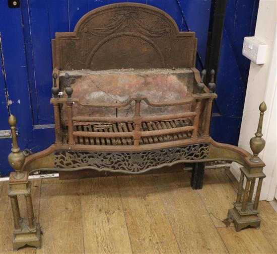A George III brass mounted steel serpentine fronted fire grate, W.105cm